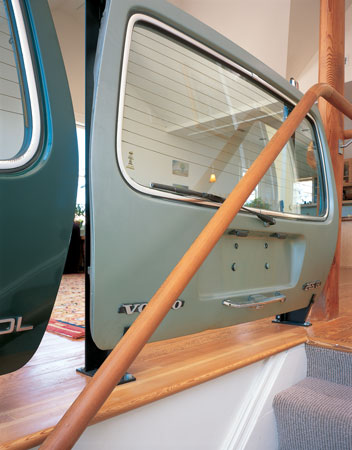 
The house’s trademark Volvo railing greets visitors as they climb the wool-carpeted stairs.

